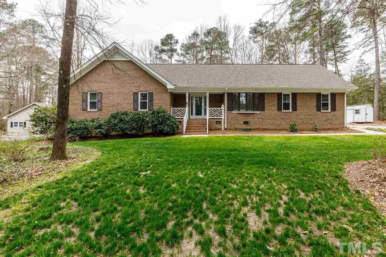 2921 Old Milburnie Road Raleigh, NC 27604 - Photo 1 of 27 a front view of a house with a yard