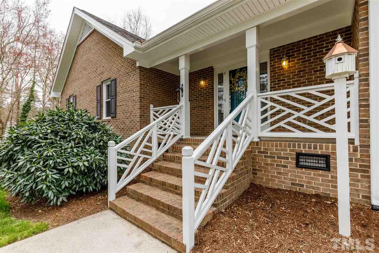 2921 Old Milburnie Road Raleigh, NC 27604 - Photo 2 of 27 a front view of a house with wooden stairs