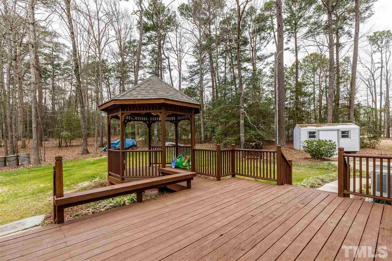 2921 Old Milburnie Road Raleigh, NC 27604 - Photo 17 of 27 a view of backyard with deck and seating area