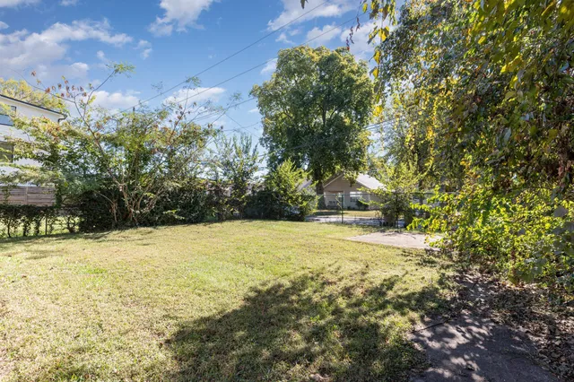 a view of a yard with an trees
