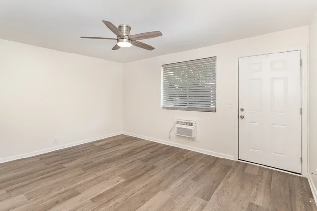 a view of an empty room with a window