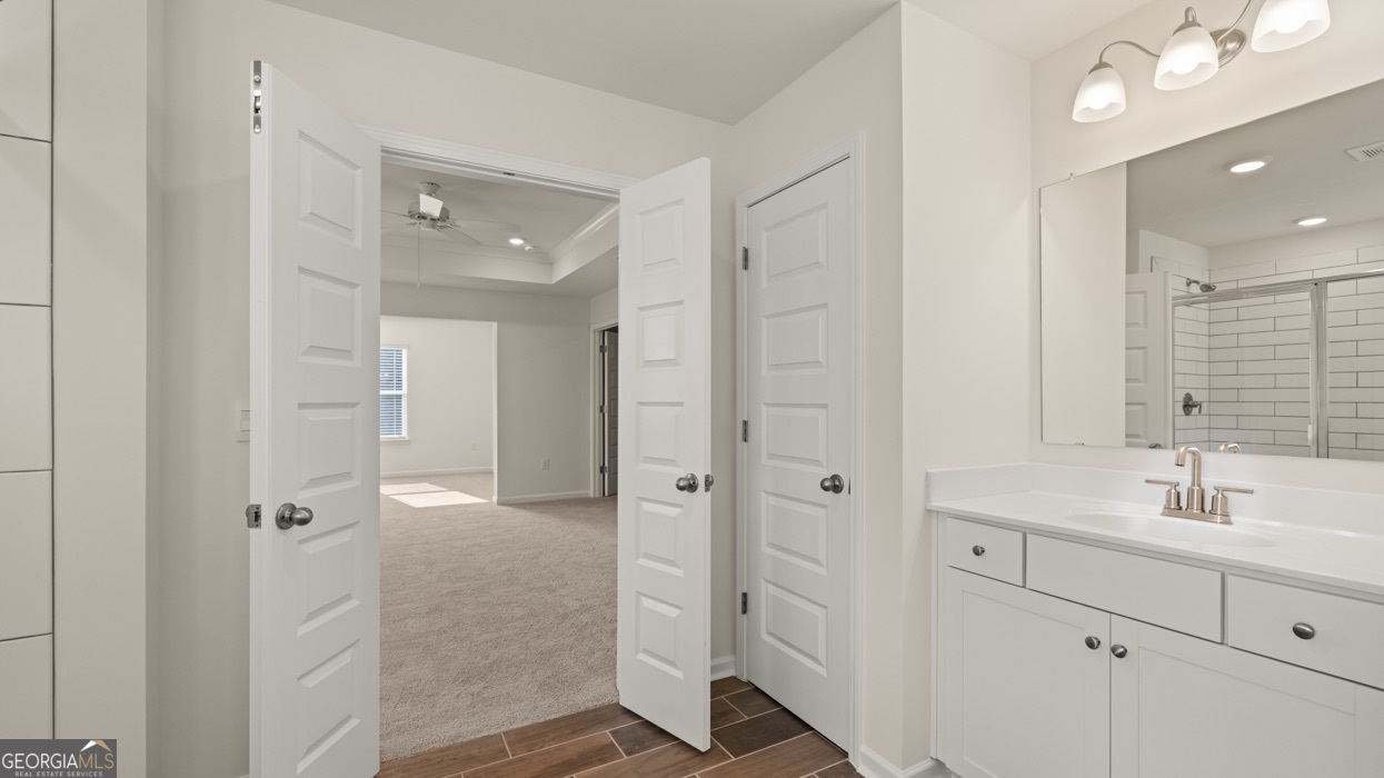 13604 Whitman Lane Covington, GA 30014 - Photo 16 of 52 a bathroom with a double vanity sink mirror and shower
