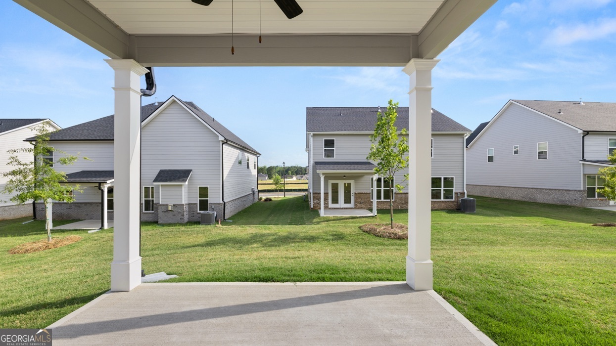 13604 Whitman Lane Covington, GA 30014 - Photo 27 of 52 a view of a house with backyard and porch