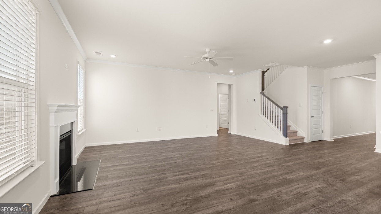 13604 Whitman Lane Covington, GA 30014 - Photo 30 of 52 a view of empty room with wooden floor and fireplace