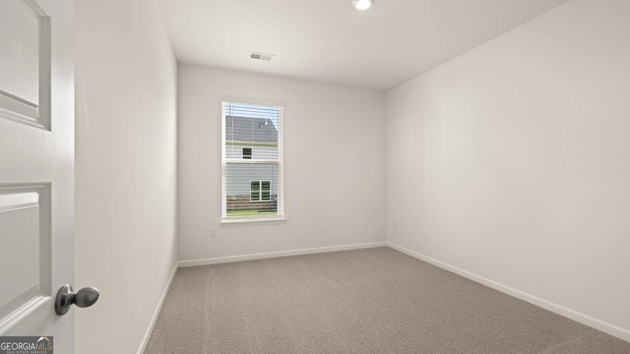 13604 Whitman Lane Covington, GA 30014 - Photo 32 of 52 an empty room with a window