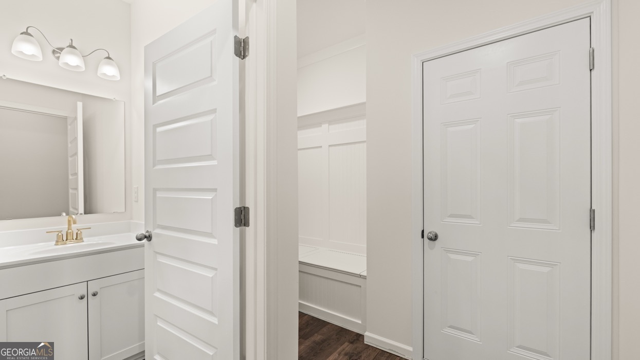 13604 Whitman Lane Covington, GA 30014 - Photo 34 of 52 a bathroom with a shower sink and mirror