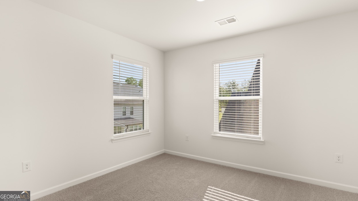 13604 Whitman Lane Covington, GA 30014 - Photo 39 of 52 a view of an empty room with a window