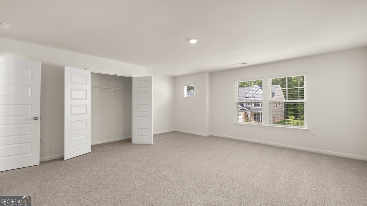 13604 Whitman Lane Covington, GA 30014 - Photo 45 of 52 an empty room with a empty space and windows