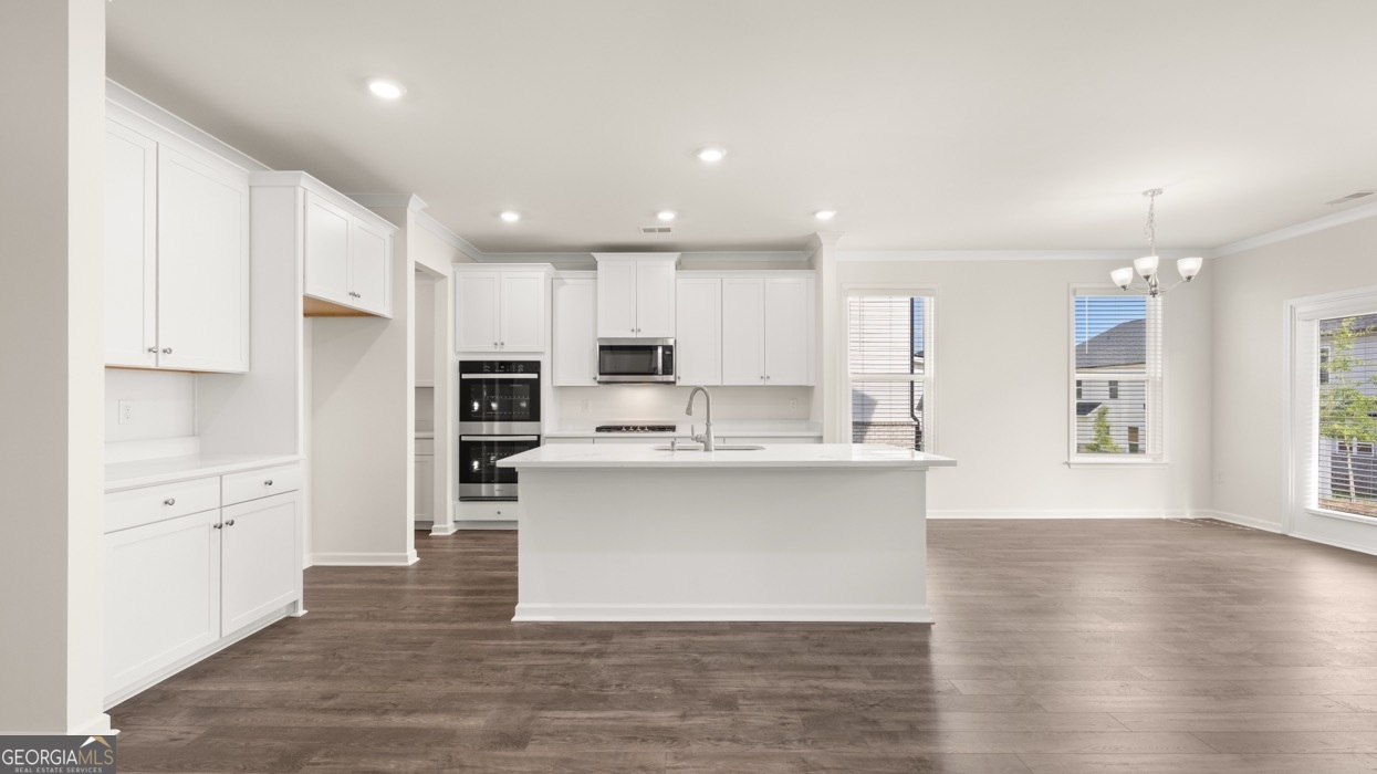 13604 Whitman Lane Covington, GA 30014 - Photo 6 of 52 a view of kitchen with wooden floor and electronic appliances