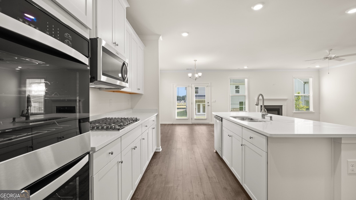 13604 Whitman Lane Covington, GA 30014 - Photo 8 of 52 a kitchen with sink stove and cabinets