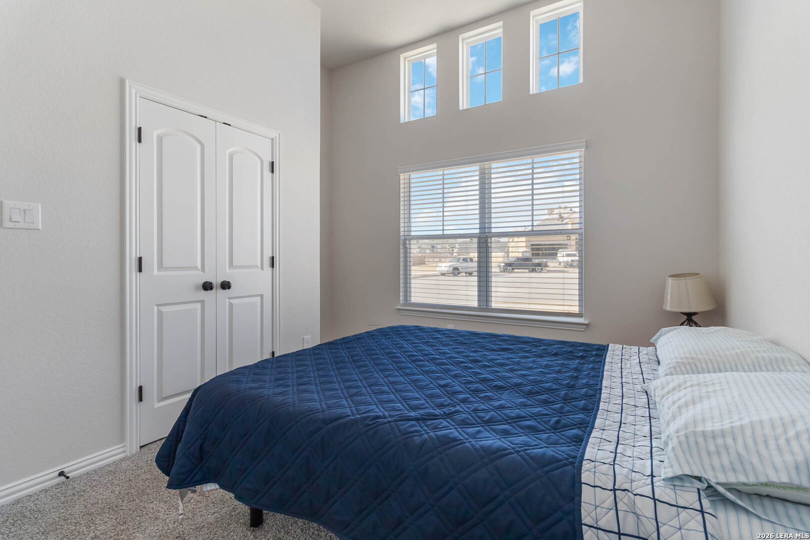 8024 Trail Grant Schertz, TX 78154 - Photo 9 of 20 a bedroom with a bed cabinet and window