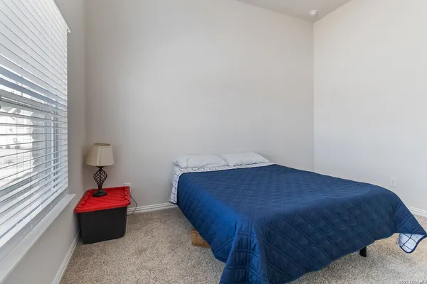 a room with a bed and a window