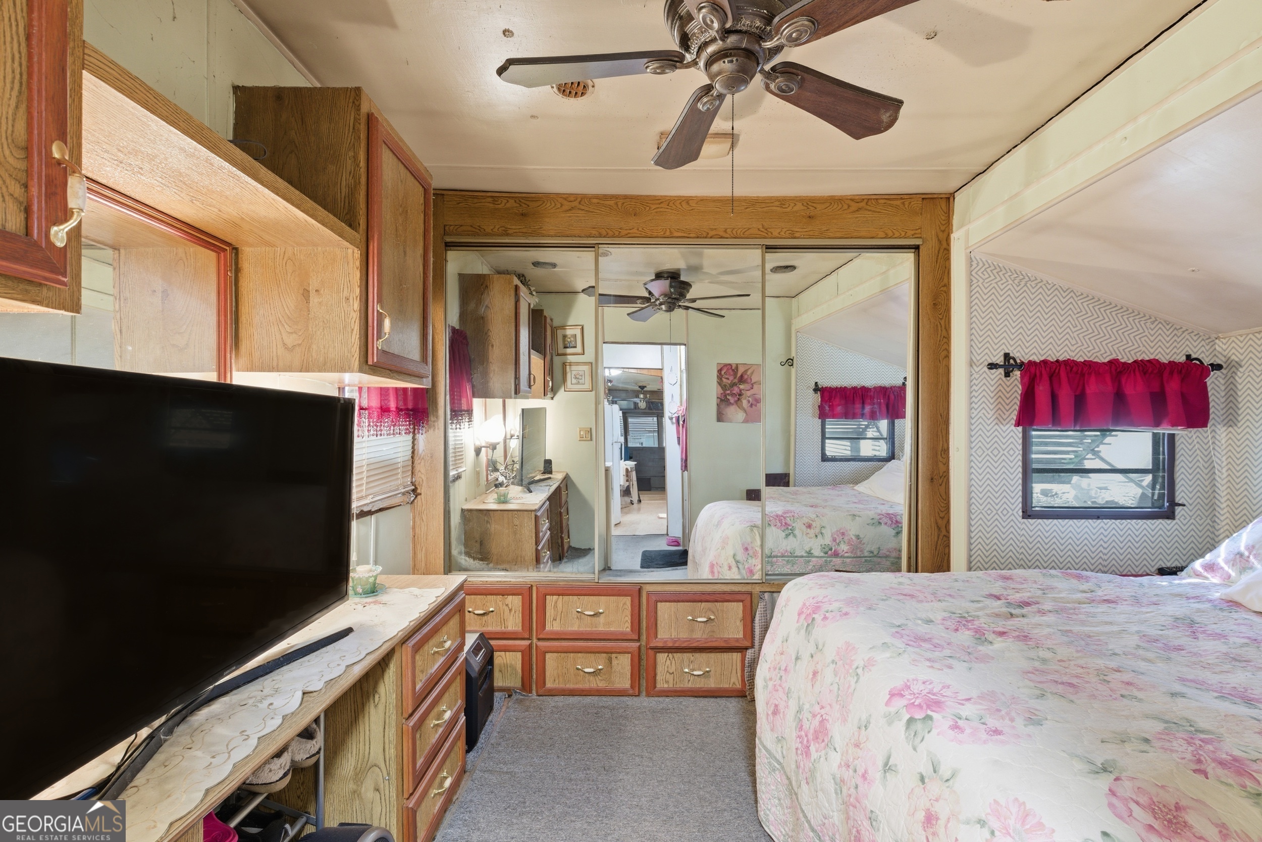 105 Holiday Loop Cleveland, GA 30528 - Photo 11 of 41 a bedroom with a bed and a flat screen tv