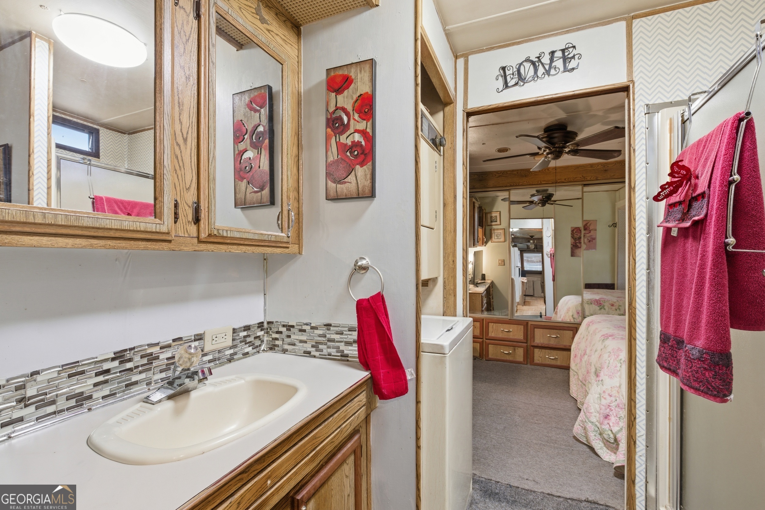 105 Holiday Loop Cleveland, GA 30528 - Photo 13 of 41 a bathroom with a sink and a mirror