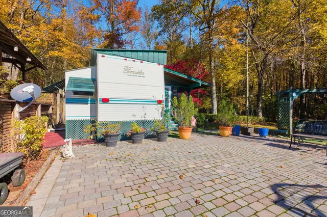 an aerial view of residential houses with outdoor space