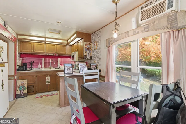 a bathroom with a shower curtain and a sink