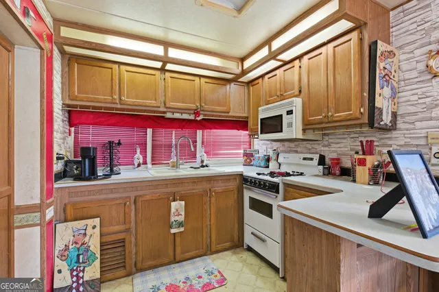 a view of a bedroom with a bed and a chandelier