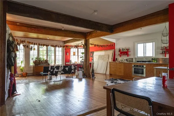a kitchen with a table chairs and a dining table
