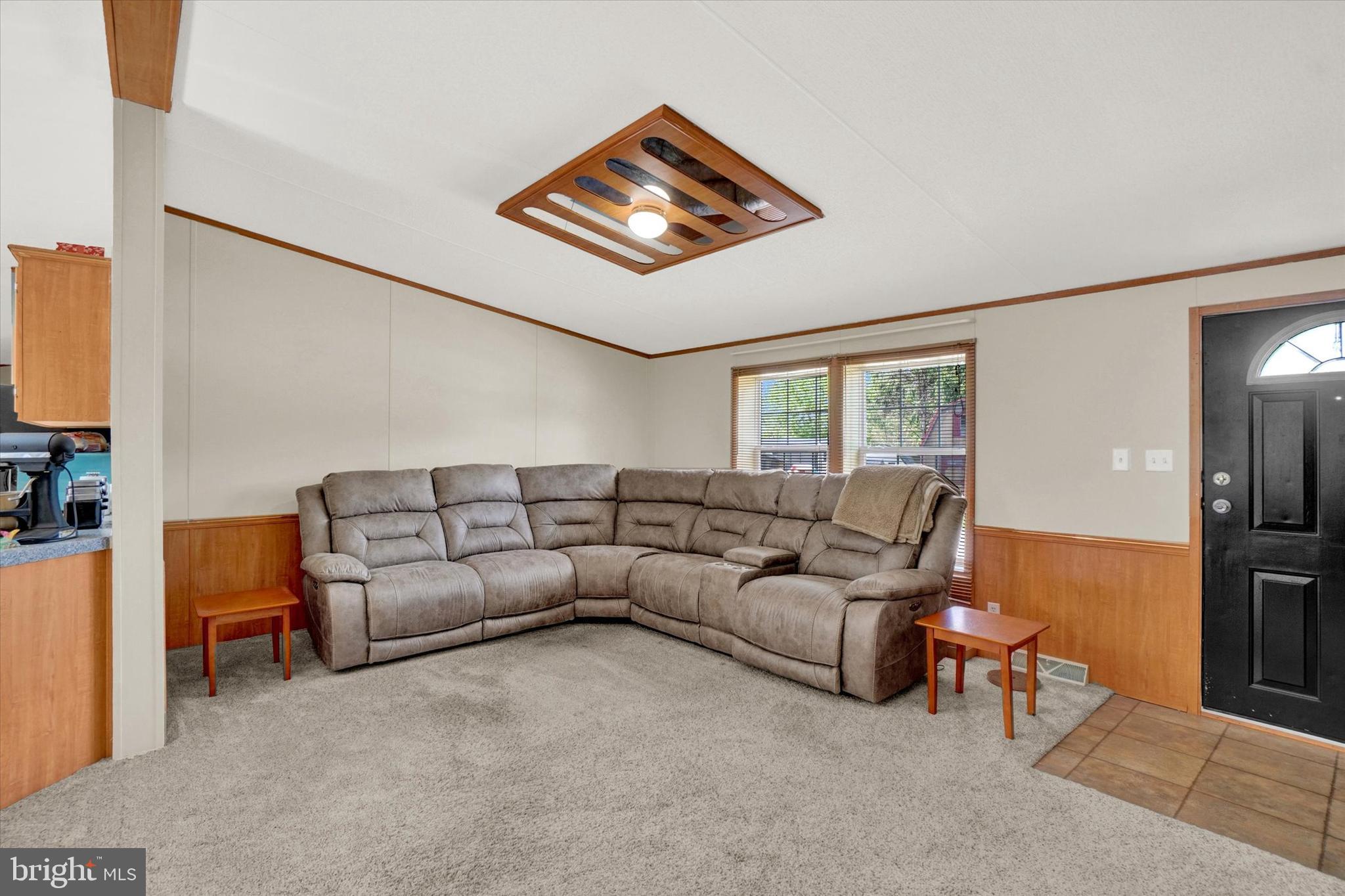 700 Cassel Road, Unit 132 Manchester, PA 17345 - Photo 11 of 26 a living room with furniture and a flat screen tv