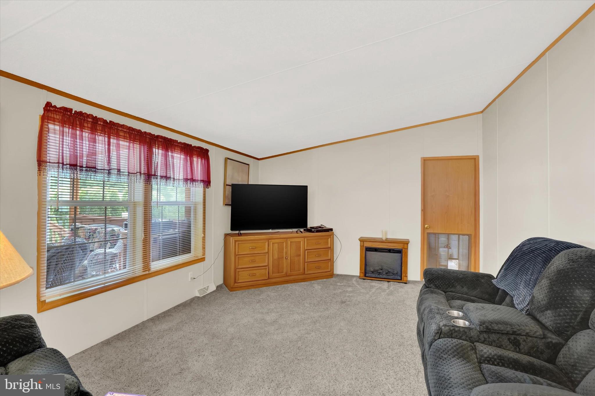 700 Cassel Road, Unit 132 Manchester, PA 17345 - Photo 14 of 26 a living room with furniture and a flat screen tv