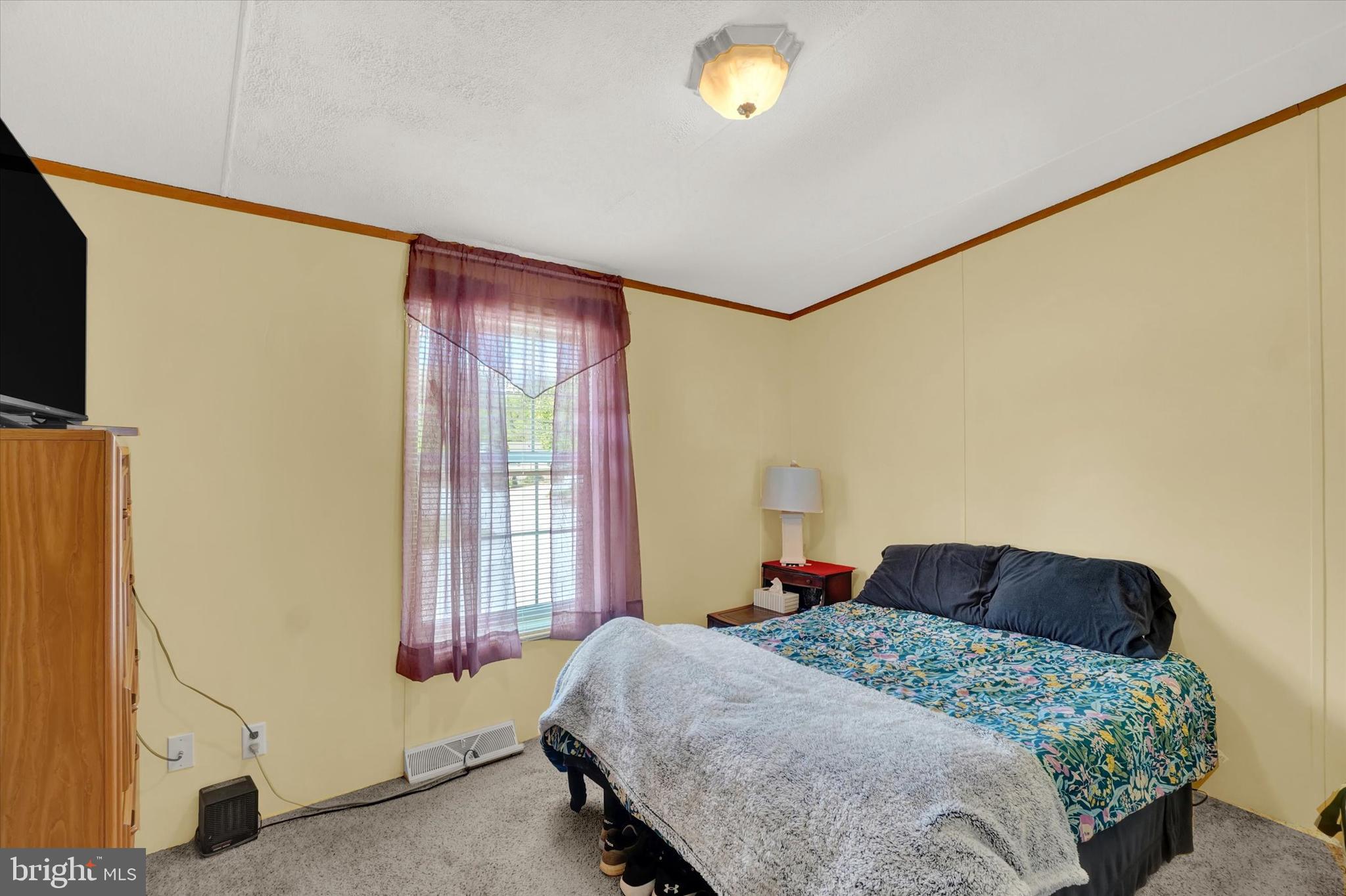 700 Cassel Road, Unit 132 Manchester, PA 17345 - Photo 16 of 26 a bedroom with a bed and a window