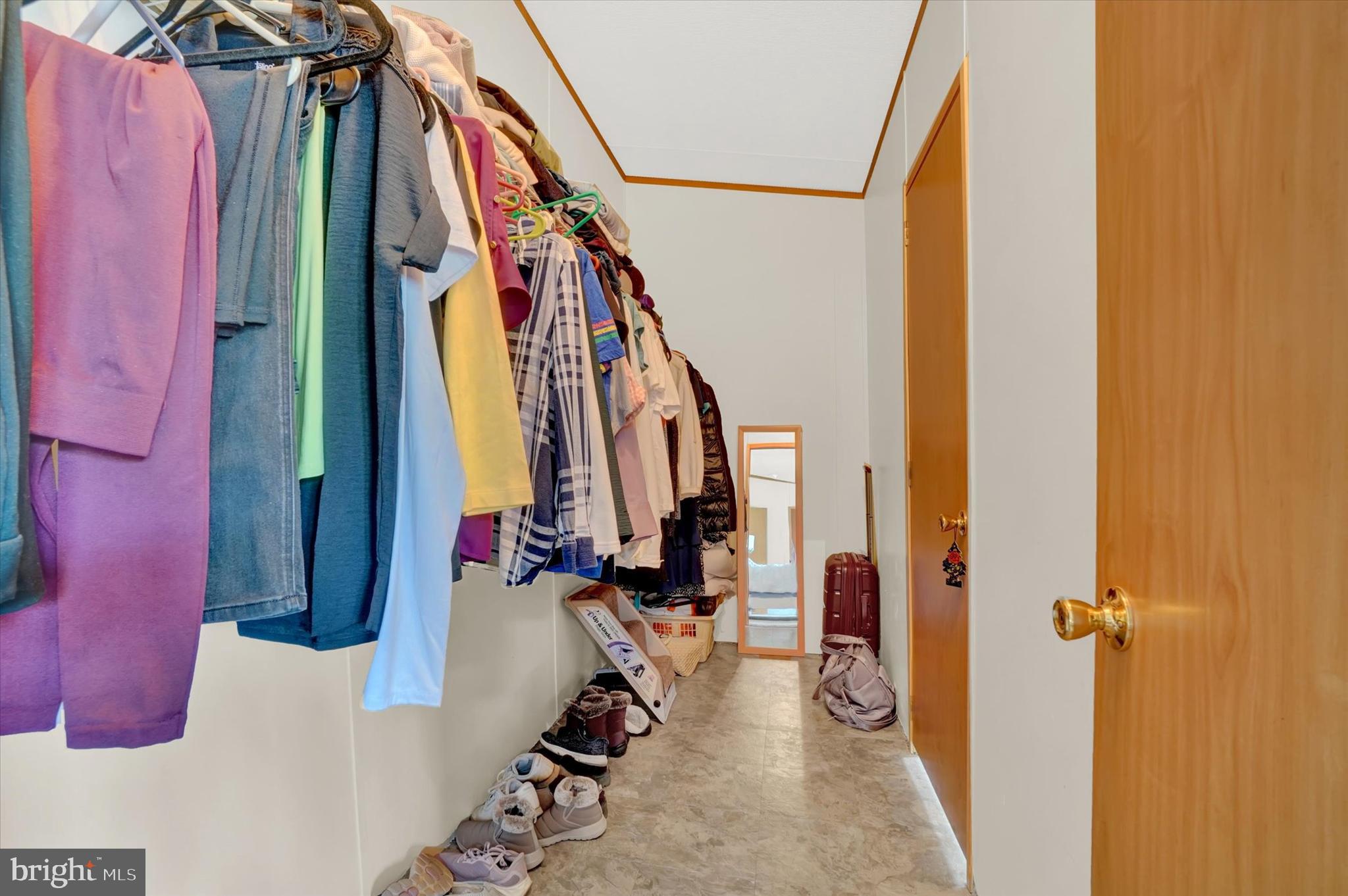 700 Cassel Road, Unit 132 Manchester, PA 17345 - Photo 22 of 26 a view of walk in closet with clothes and shoes