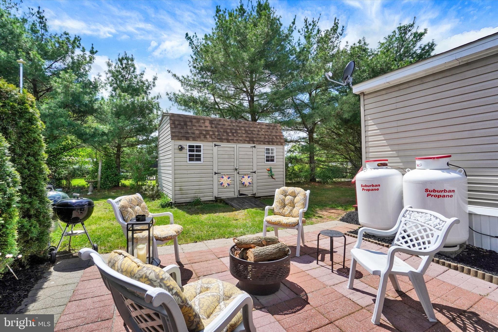 700 Cassel Road, Unit 132 Manchester, PA 17345 - Photo 4 of 26 a view of a patio with a table chairs and a fire pit