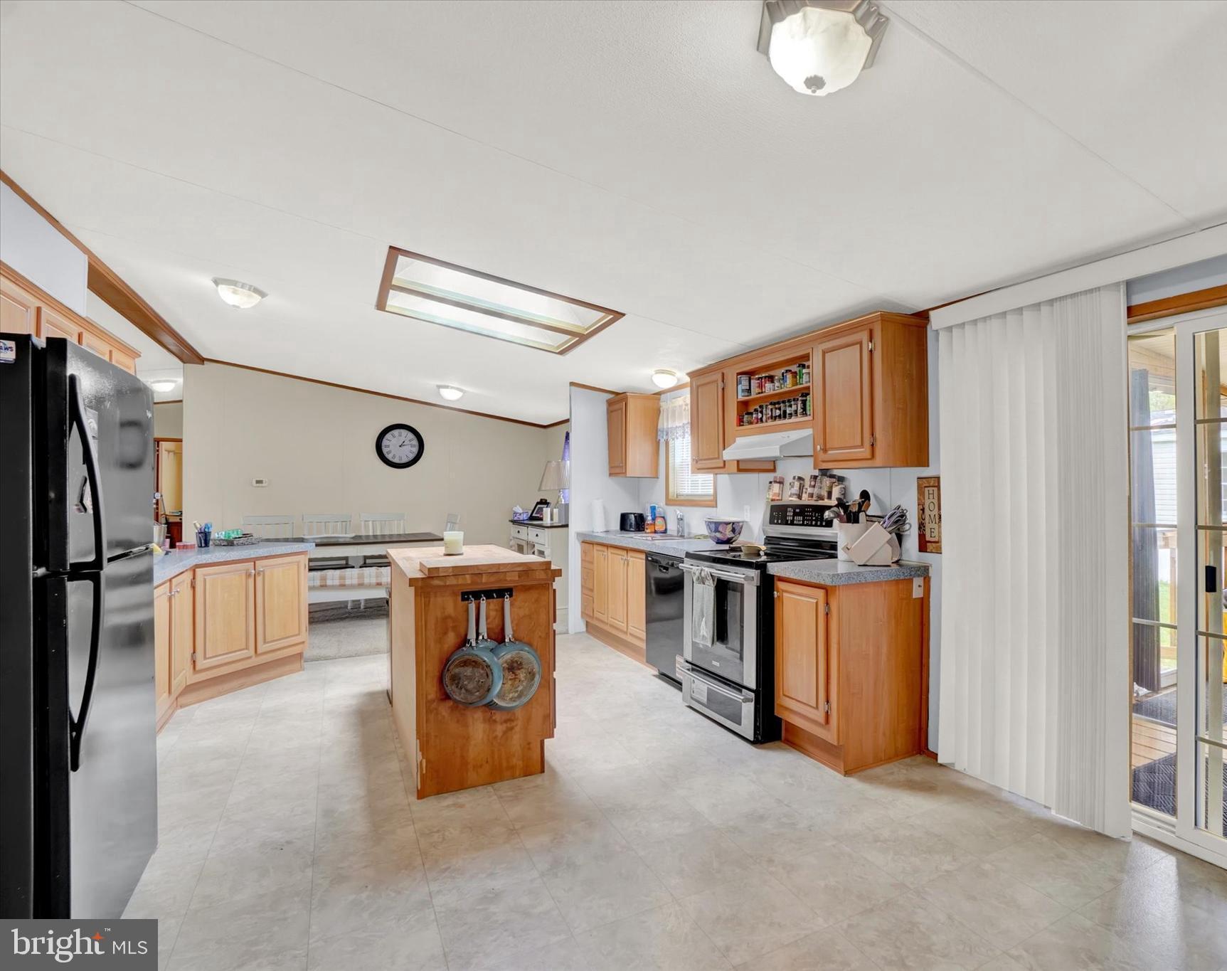 700 Cassel Road, Unit 132 Manchester, PA 17345 - Photo 7 of 26 a room with stainless steel appliances kitchen island granite countertop a refrigerator and a stove top oven