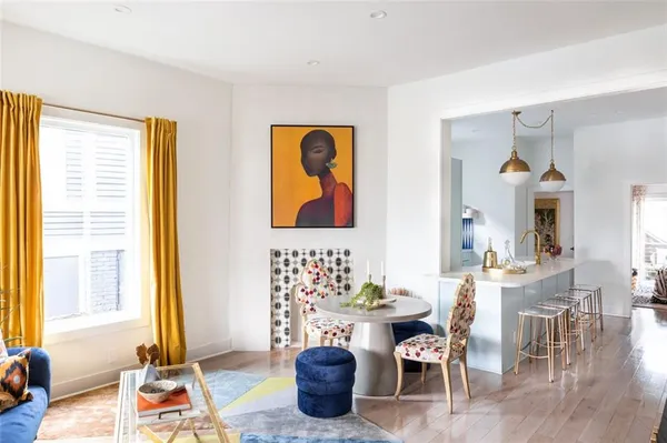 a dining room with furniture a window and a chandelier
