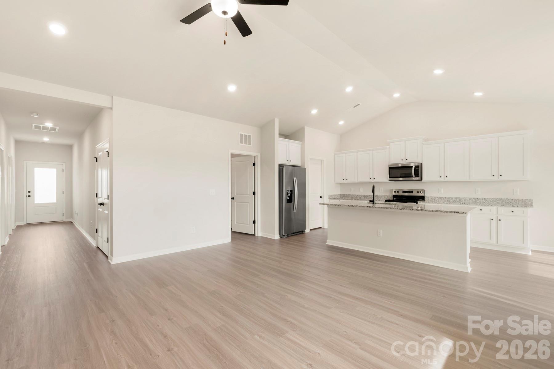 285 Limestone Terrace Salisbury, NC 28146 - Photo 4 of 22 a view of kitchen with stainless steel appliances refrigerator stove microwave and cabinets