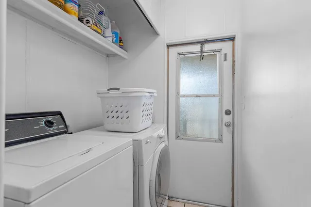 a utility room with dryer and washer