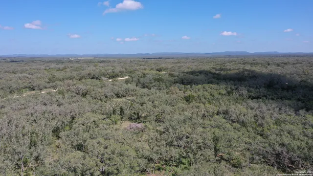 a view of a big yard with an outdoor space