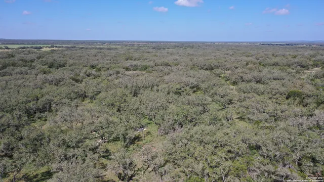 a view of a field with an outdoor space