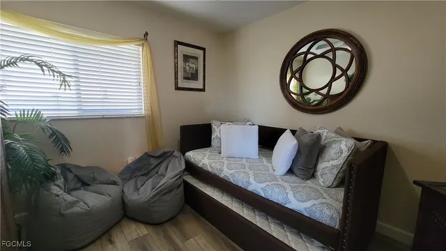 a bedroom with a bed and a dresser