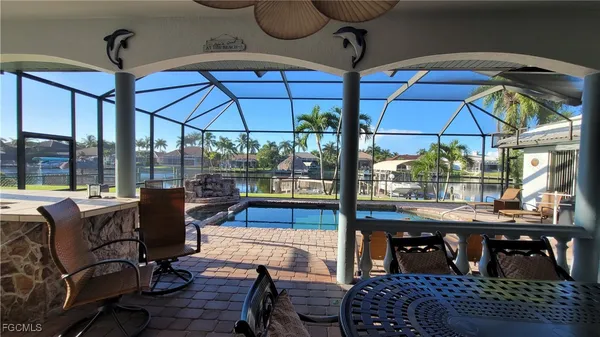 a kitchen with a sink and wooden cabinets