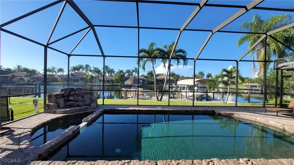 a view of a swimming pool and sitting area