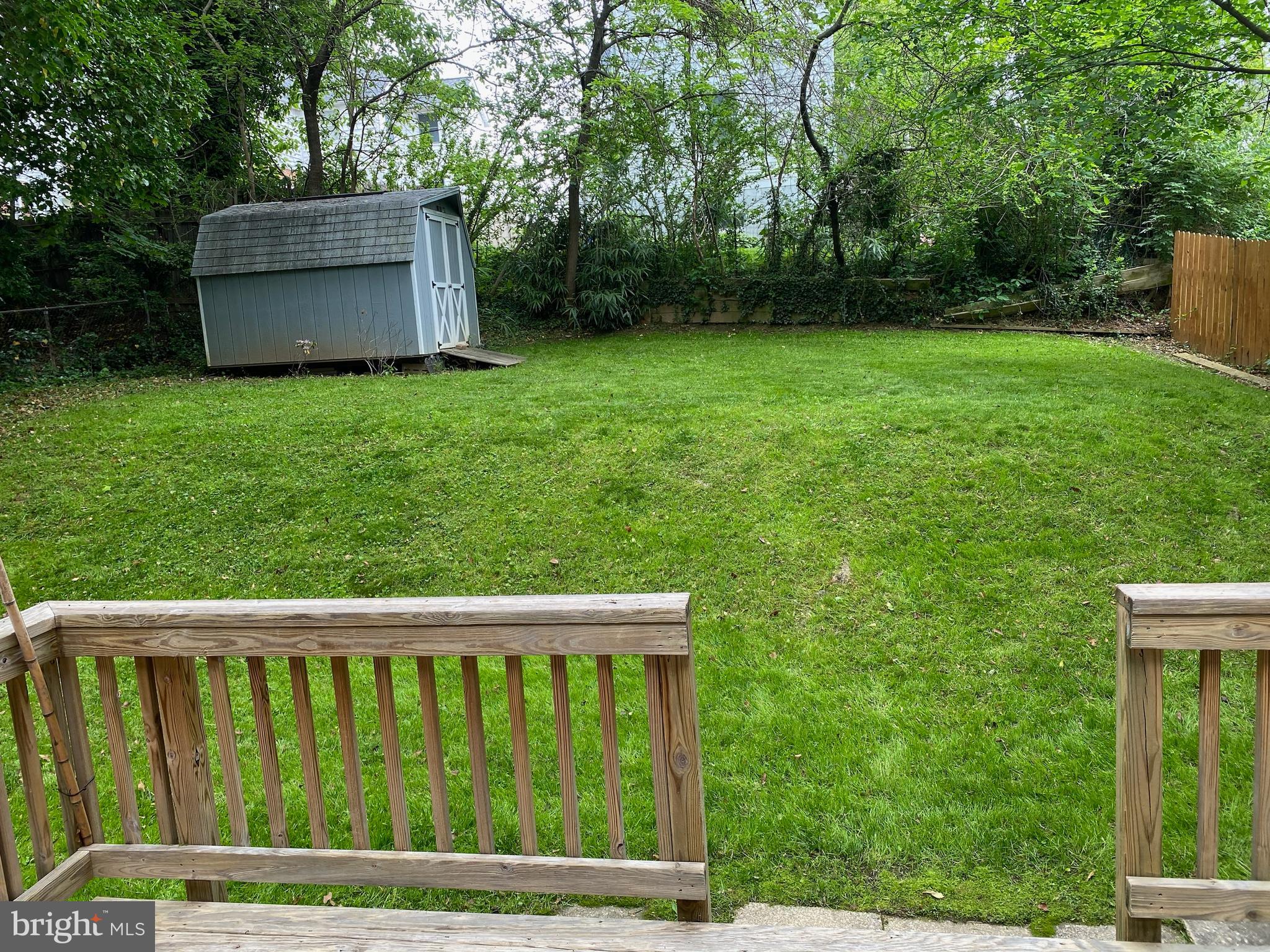 9303 Glenville Road Silver Spring, MD 20901 - Photo 10 of 38 Lovely yard with a storage shed and deck