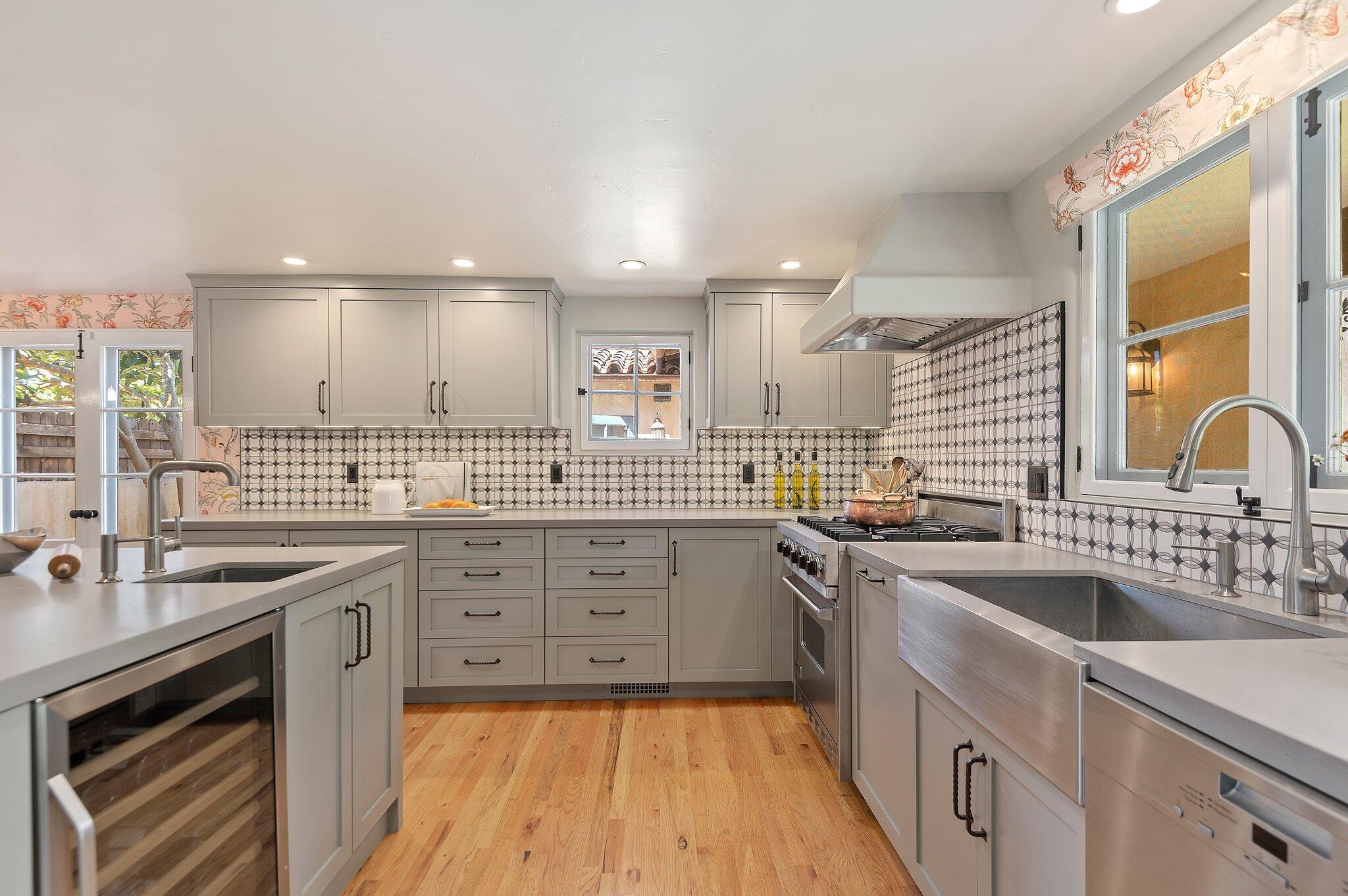 1520 Lingate Lane Montecito, CA 93108 - Photo 14 of 38 a kitchen with a sink stove and cabinets