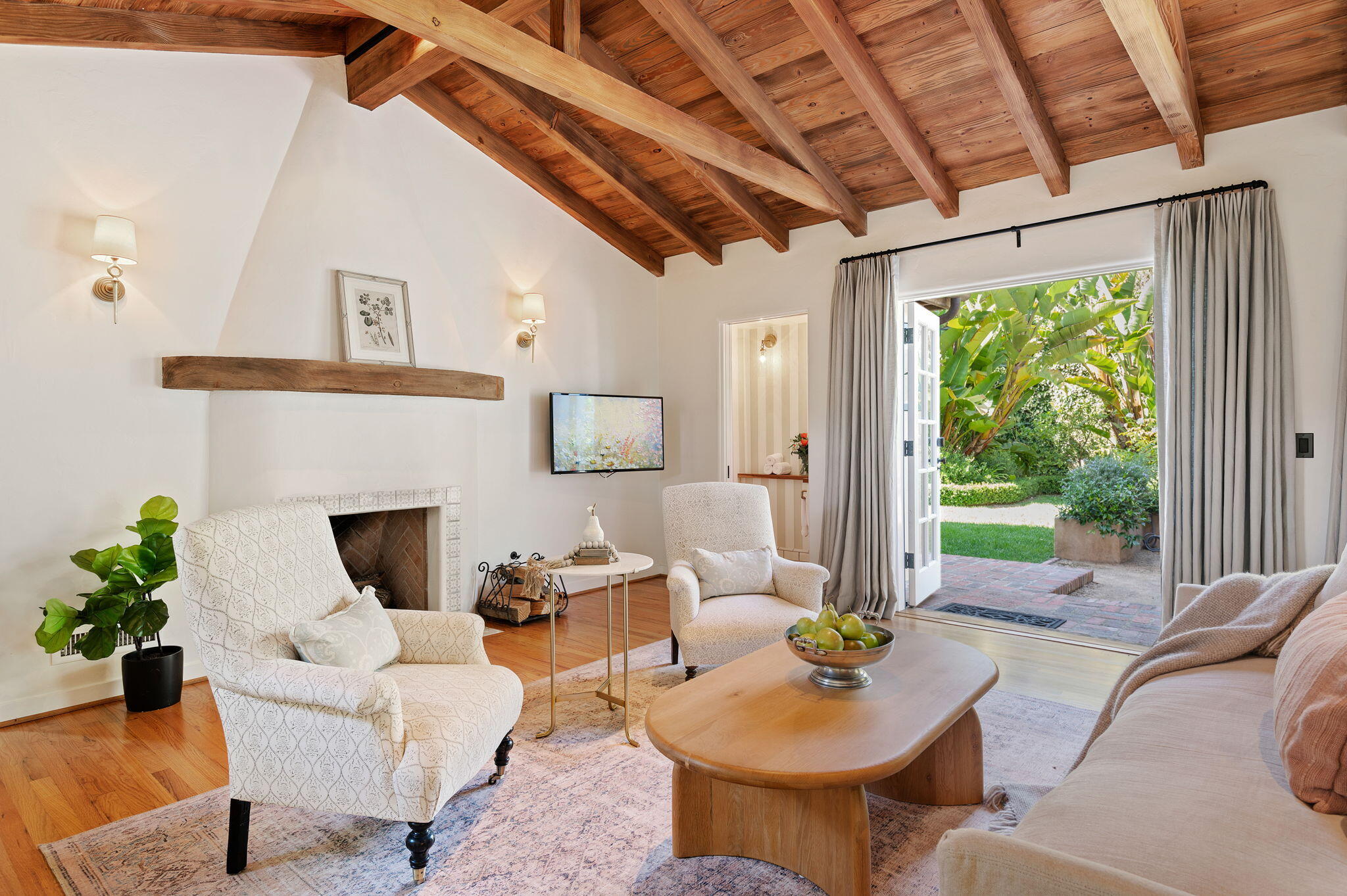 1520 Lingate Lane Montecito, CA 93108 - Photo 2 of 38 a living room with furniture a fireplace and a potted plant