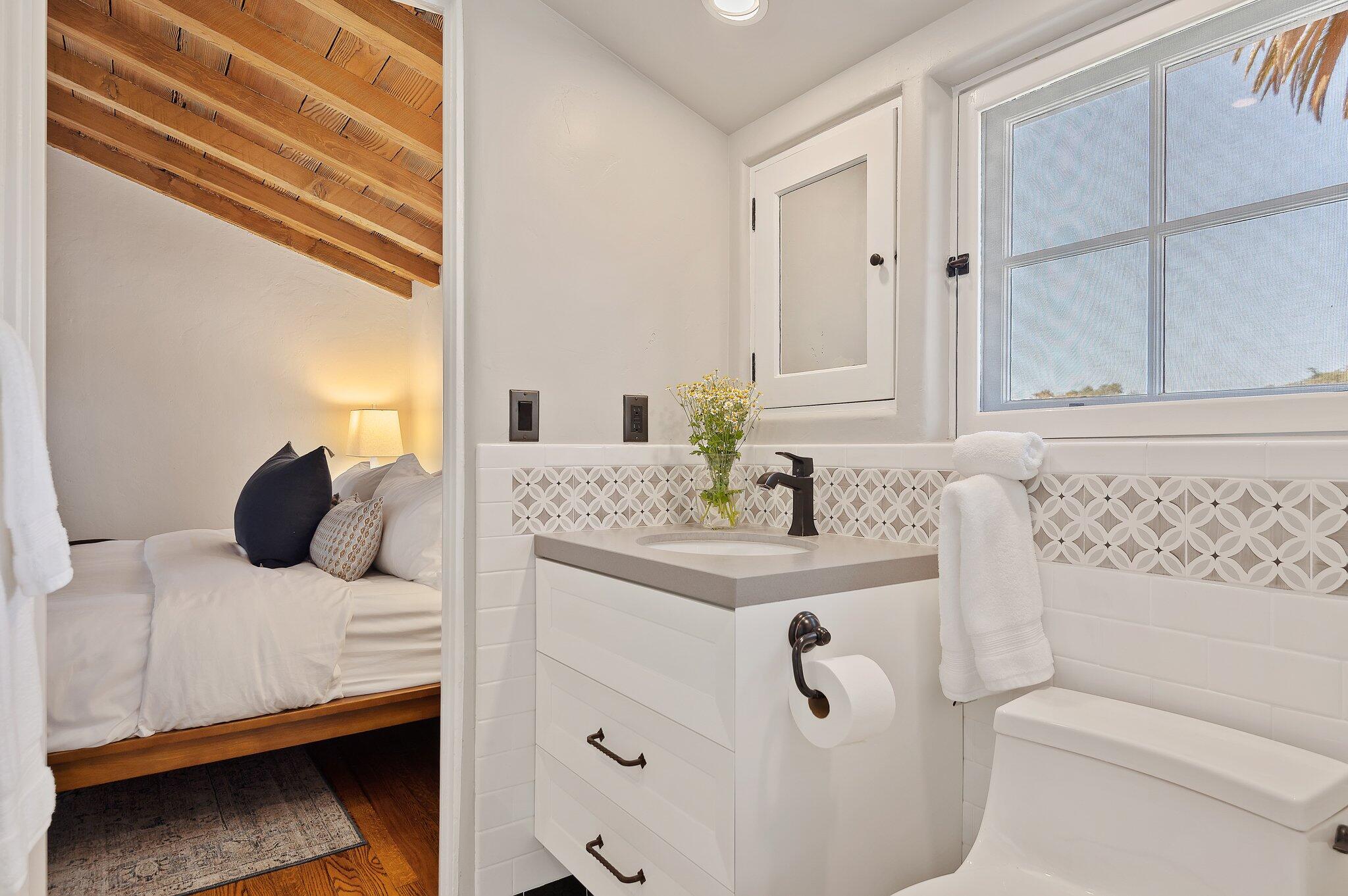 1520 Lingate Lane Montecito, CA 93108 - Photo 21 of 38 a bedroom with a bed and a window