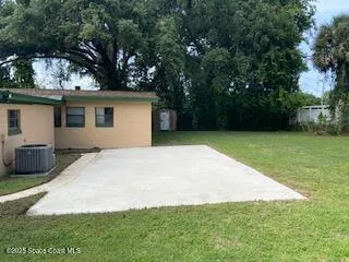 a view of a backyard with a cabin