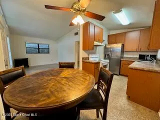 a bed room with furniture and a chandelier