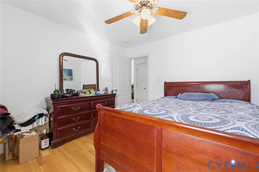 15900 Nobles Road Disputanta, VA 23842 - Photo 14 of 36 Bedroom with light hardwood finished floors and a