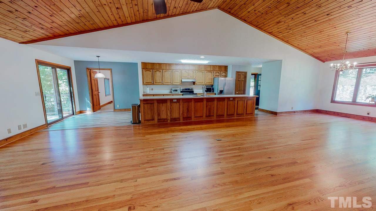 49 Stonegate Drive Roxboro, NC 27574 - Photo 14 of 30 a view of livingroom with furniture wooden floor and windows