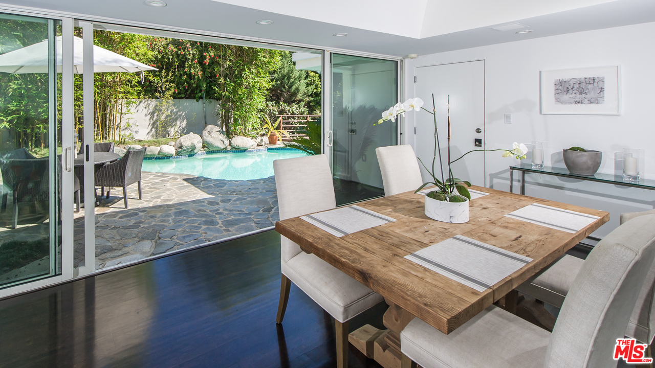 1908 North Beverly Drive Beverly Hills, CA 90210 - Photo 15 of 32 a view of a dining room with furniture window and wooden floor