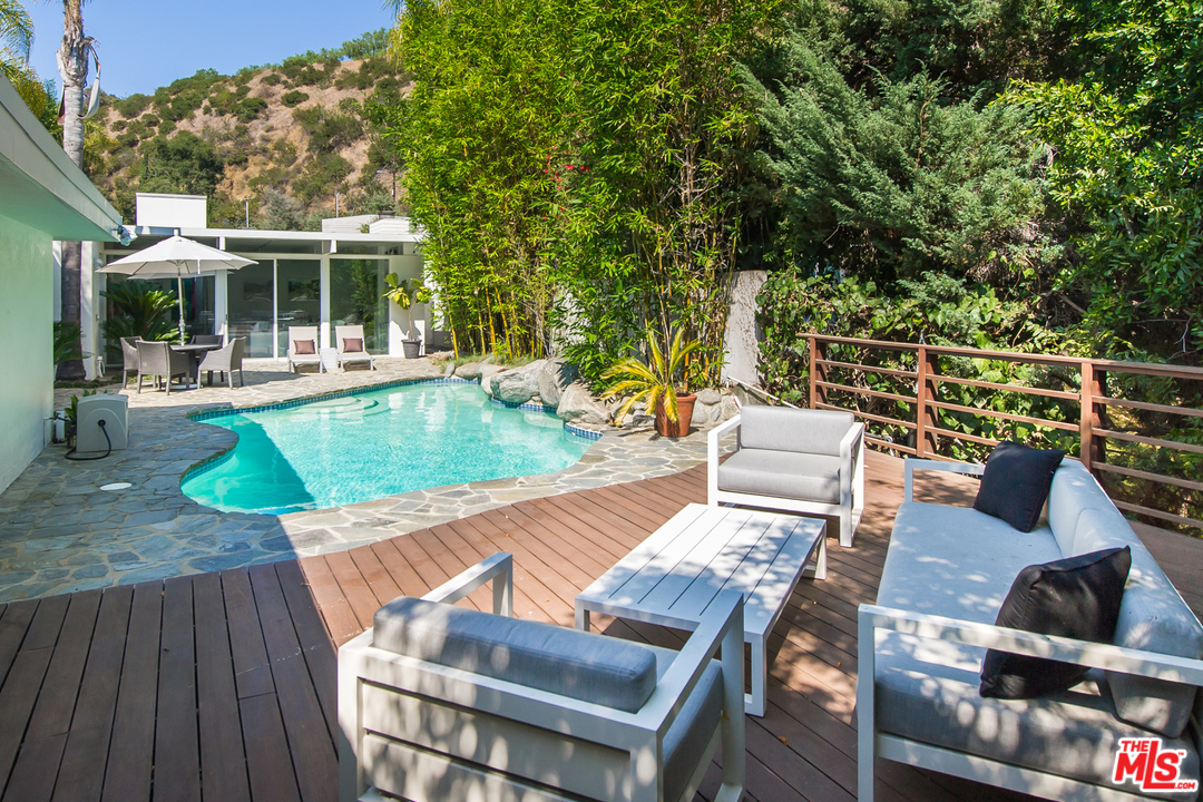 1908 North Beverly Drive Beverly Hills, CA 90210 - Photo 21 of 32 swimming pool view with a seating space