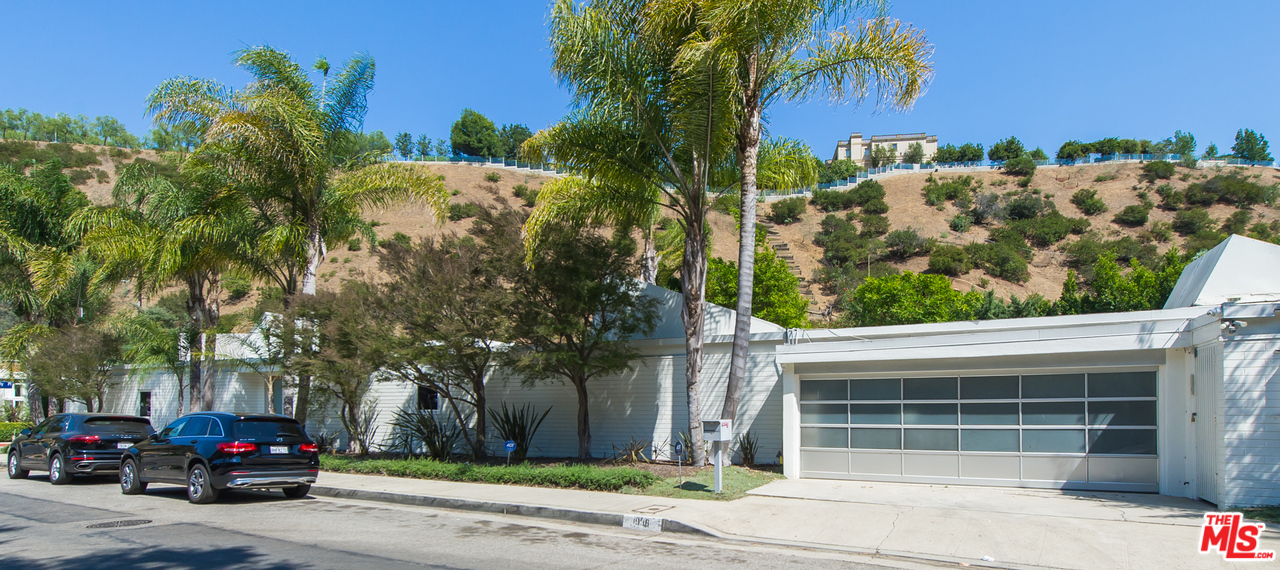 1908 North Beverly Drive Beverly Hills, CA 90210 - Photo 4 of 32 a view of a car park in front of a building