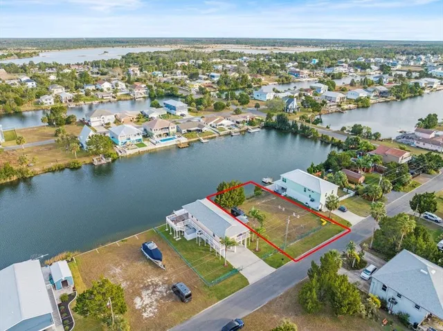 an aerial view of a house with a lake view