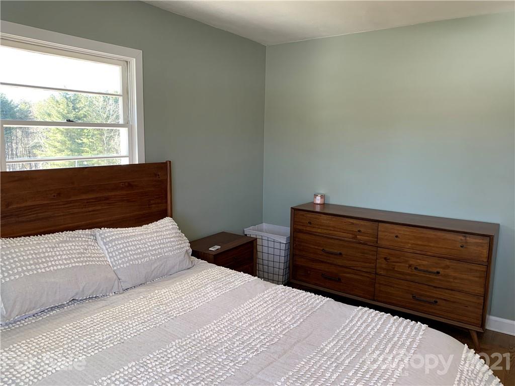40 Brown Cove Road Clyde, NC 28721 - Photo 22 of 33 a bedroom with a bed and a window