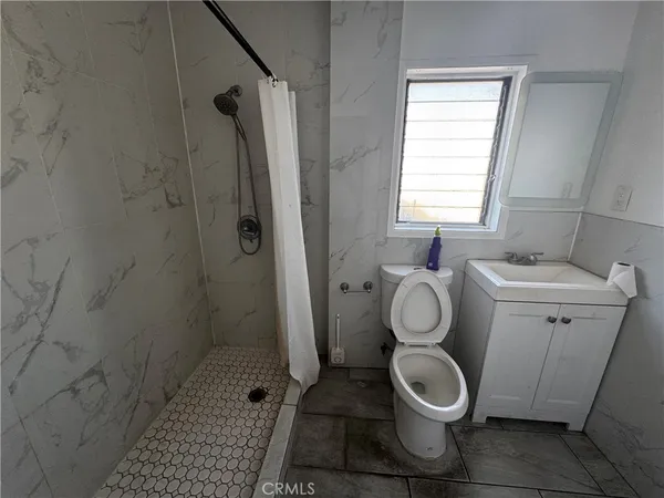 a bathroom with a toilet and a sink